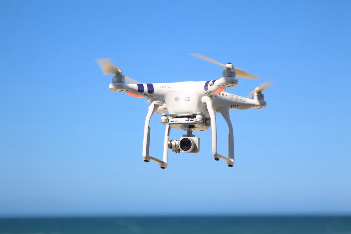 Camera-equipped drone in flight
