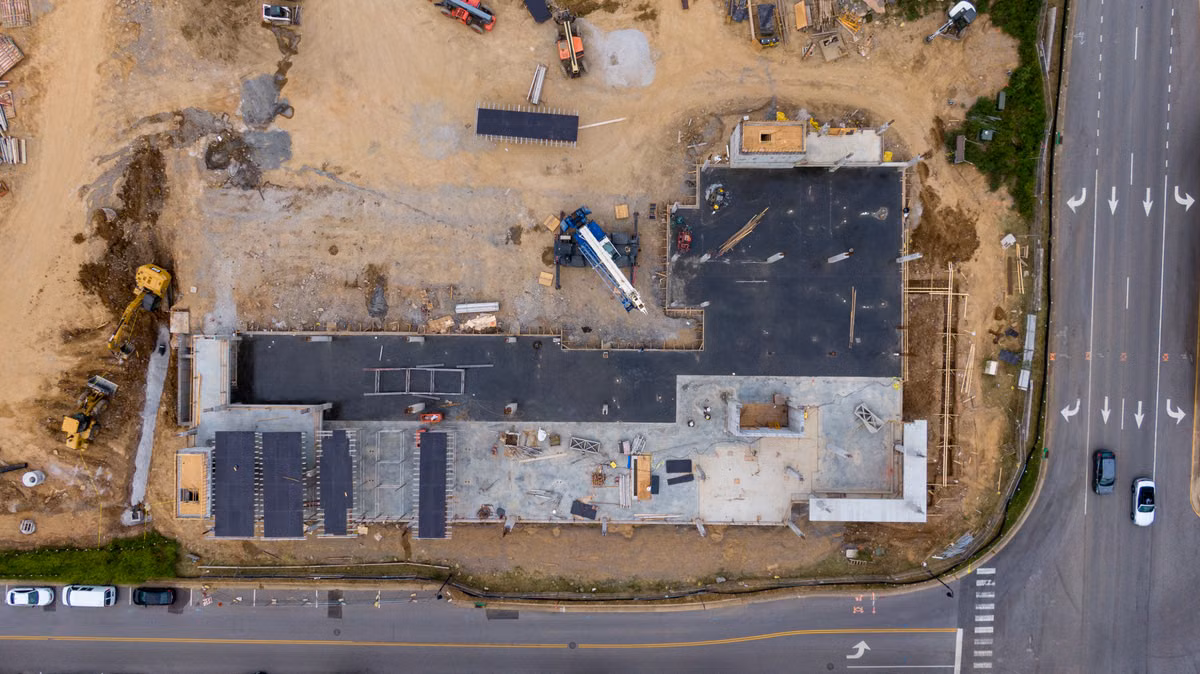 Aerial view of land and a construction site