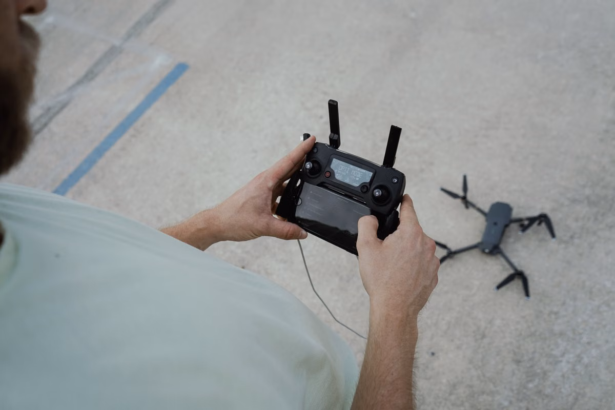 Drone operator preparing a drone for flight